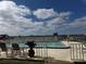 Relaxing community pool area overlooking the water at 144 S Halifax Ave # 74, Daytona Beach, FL 32118