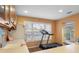 Bright exercise room features a treadmill and water view at 1069 Indigo Rd, Ormond Beach, FL 32174