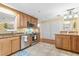 Kitchen with granite countertops, stainless steel appliances, and wood cabinets at 1069 Indigo Rd, Ormond Beach, FL 32174