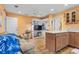 Living room with kitchenette and built-in shelving at 1069 Indigo Rd, Ormond Beach, FL 32174