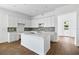 Modern kitchen with white cabinets and quartz island at 1281 Champions Dr, Daytona Beach, FL 32124