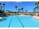 Inviting community pool with ample lounge chairs at 1281 Champions Dr, Daytona Beach, FL 32124