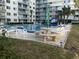 Inviting pool area with lounge chairs and picnic tables at 2727 N Atlantic Ave # 203, Daytona Beach, FL 32118