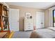 Bedroom with a dresser and a view of the patio at 10 Ocean Palm Villa S # 10, Flagler Beach, FL 32136