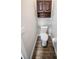 Small powder room with a toilet and wood-look flooring at 3242 Bailey Ann Dr, Ormond Beach, FL 32174