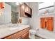 Clean bathroom with granite countertop and wood cabinets at 3242 Bailey Ann Dr, Ormond Beach, FL 32174