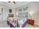 Main bedroom with king bed and ensuite bathroom access at 3242 Bailey Ann Dr, Ormond Beach, FL 32174