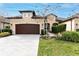 Two-story house with brown garage door and manicured lawn at 3242 Bailey Ann Dr, Ormond Beach, FL 32174