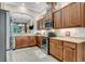 Modern kitchen with stainless steel appliances and wood cabinets at 3242 Bailey Ann Dr, Ormond Beach, FL 32174