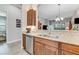 Kitchen with double sink, dishwasher, and wood cabinets at 3242 Bailey Ann Dr, Ormond Beach, FL 32174