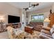 Relaxing living room featuring comfortable seating and a large TV at 3242 Bailey Ann Dr, Ormond Beach, FL 32174
