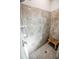 Clean and bright shower stall with tile walls and a wooden bench at 3242 Bailey Ann Dr, Ormond Beach, FL 32174