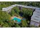 An apartment building with a pool and surrounding green space at 640 N Nova Rd # 212, Ormond Beach, FL 32174