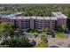 An apartment building with ample parking and nearby green areas at 640 N Nova Rd # 212, Ormond Beach, FL 32174