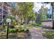 Relaxing courtyard with lush landscaping and walking path at 640 N Nova Rd # 212, Ormond Beach, FL 32174