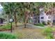 Landscaped courtyard, green space, and walking path at 640 N Nova Rd # 212, Ormond Beach, FL 32174