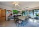 Bright community room with tables and chairs at 640 N Nova Rd # 212, Ormond Beach, FL 32174