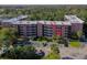 The exterior of the condo building features convenient parking and easy access to residential units at 640 N Nova Rd # 212, Ormond Beach, FL 32174