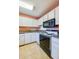 Kitchen boasts granite countertops and ample cabinet space at 640 N Nova Rd # 212, Ormond Beach, FL 32174