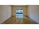 Spacious living room featuring tiled floors and sliding glass doors to balcony at 640 N Nova Rd # 212, Ormond Beach, FL 32174