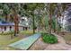 Outdoor shuffleboard court nestled in a shady area at 640 N Nova Rd # 212, Ormond Beach, FL 32174