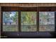 View of lush landscaping from the screened-in window at 640 N Nova Rd # 212, Ormond Beach, FL 32174
