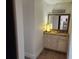 Chic powder room with a stylish vanity, granite countertop, and decorative mirror at 935 N Halifax Ave # 602, Daytona Beach, FL 32118