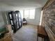 Bright bedroom with light wood floors, large window and decorative wood accent wall at 935 N Halifax Ave # 602, Daytona Beach, FL 32118