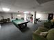 Spacious billiard room with pool tables, bar, and seating areas for residents' enjoyment at 935 N Halifax Ave # 602, Daytona Beach, FL 32118