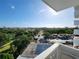 Balcony view shows a city skyline with parks, and tennis courts in the distance on a sunny day at 935 N Halifax Ave # 602, Daytona Beach, FL 32118