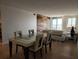 Open-concept dining area flowing into a living space, enhanced by stylish decor at 935 N Halifax Ave # 602, Daytona Beach, FL 32118