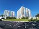 Condominium buildings feature multiple balconies, parking and green spaces, creating a vibrant and convenient living environment at 935 N Halifax Ave # 602, Daytona Beach, FL 32118