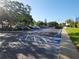 Expansive parking lot with mature trees, ample spaces, and accessible parking for easy access at 935 N Halifax Ave # 602, Daytona Beach, FL 32118