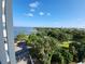 Scenic view of the water and lush greenery from a high-rise balcony on a sunny day at 935 N Halifax Ave # 602, Daytona Beach, FL 32118