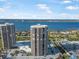 High-rise building with water views, ample parking, and surrounding landscape at 1 Oceans West Blvd # 16A4, Daytona Beach, FL 32118