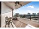 Balcony with ocean view and small table and chairs at 1 Oceans West Blvd # 16A4, Daytona Beach, FL 32118