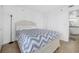 Bedroom with gray bedding and built-in drawers at 1 Oceans West Blvd # 16A4, Daytona Beach Shores, FL 32118