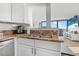 Modern kitchen with stainless steel appliances and granite countertops at 1 Oceans West Blvd # 16A4, Daytona Beach Shores, FL 32118