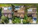 Aerial perspective of three homes with pools and yards at 10 Ocean Pines Dr, Ormond Beach, FL 32174