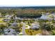 Aerial view showcasing a neighborhood with houses near a lake at 10 Ocean Pines Dr, Ormond Beach, FL 32174