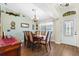 Bright dining room with a wooden table and chairs, near entryway at 10 Ocean Pines Dr, Ormond Beach, FL 32174