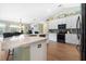 Updated kitchen, featuring white cabinets and granite countertops at 10 Ocean Pines Dr, Ormond Beach, FL 32174