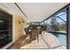 Covered patio with dining table and chairs near the pool at 10 Ocean Pines Dr, Ormond Beach, FL 32174