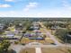 Aerial view showcasing home, pool, and surrounding neighborhood at 1102 Rolling Acres Dr, Deland, FL 32720