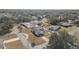 Aerial view showing home, pool, and surrounding neighborhood at 1102 Rolling Acres Dr, Deland, FL 32720