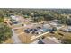 Aerial view highlighting home, pool, and surrounding area at 1102 Rolling Acres Dr, Deland, FL 32720