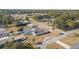 Aerial view showing home with pool, large yard, and neighborhood context at 1102 Rolling Acres Dr, Deland, FL 32720