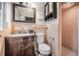 Clean bathroom with shower, toilet and dark brown vanity at 1102 Rolling Acres Dr, Deland, FL 32720