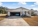 Attached garage with ample space for vehicles at 1102 Rolling Acres Dr, Deland, FL 32720