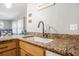 Modern kitchen sink with a sleek faucet and granite countertop at 1102 Rolling Acres Dr, Deland, FL 32720